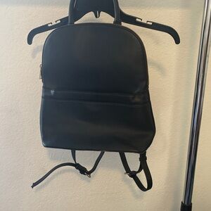 a new day Black Backpack